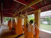 Little monks fixing a water feature - Luang Prabang, Laos