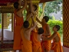 Little monks fixing a water feature - Luang Prabang, Laos