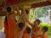 Little monks fixing a water feature - Luang Prabang, Laos